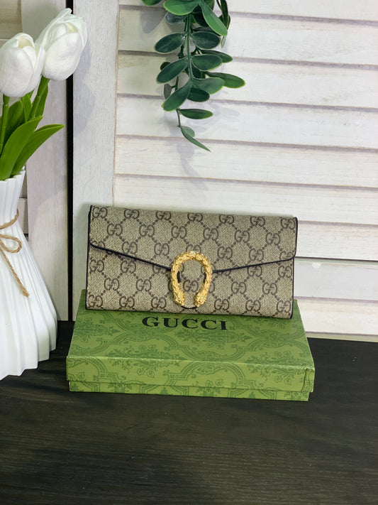 Two large Gucci purses with a box