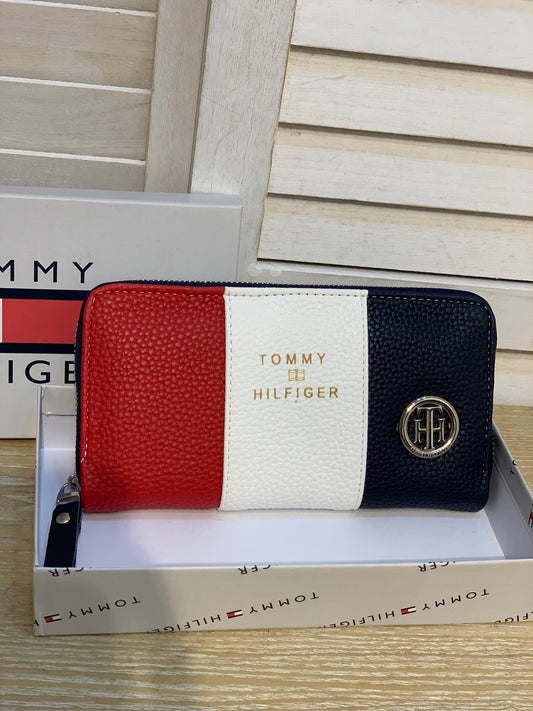 Two Tommy wallets with box