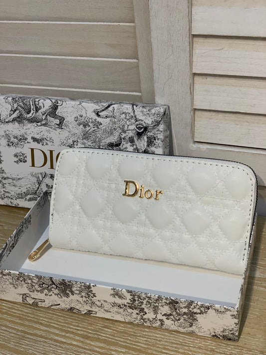Two white Dior purses with a box