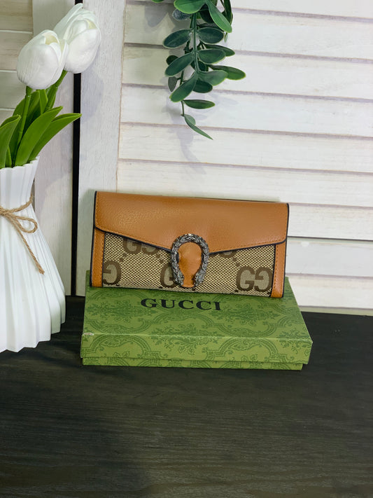 Two large Gucci purses with a box